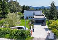 Luxus im Grünen: Architektenvilla mit mediterranem Flair und Alpenpanorama