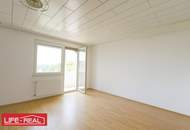 Großzügige 4-Zimmer-Wohnung mit Loggia und Stellplatz – Potenzial zur Sanierung vorhanden