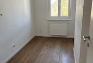 Schöne DG-Wohnung in ruhiger Lage mit hochwertiger Küche & langem Balkon