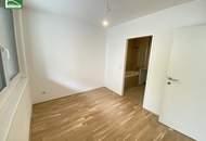 Neuwertige 2-Zimmer-Wohnung mit großer Innenhof-Fensterfront, Balkon und moderner Komplettküche! Nähe Millennium City, Handelskai und Donau. - WOHNTRAUM
