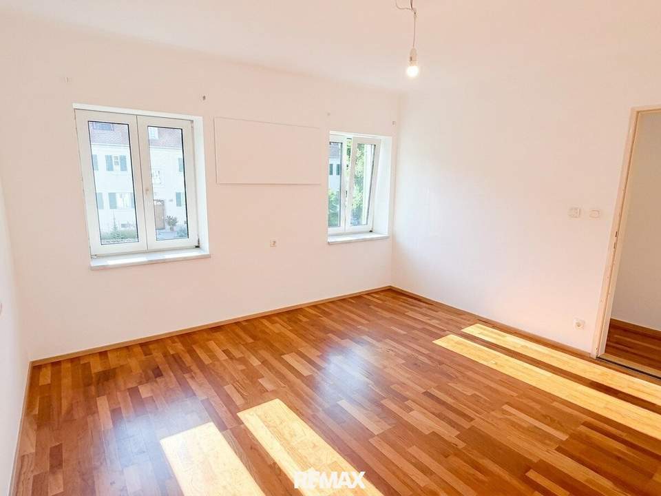2-Zimmer-Mietwohnung mit 80 m² Eigengarten und PKW-Abstellplatz