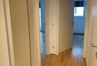 Exquisites Neubau-Juwel im Botschaftsviertel: Moderne 3-Zimmer-Wohnung mit Sicherheitsfeatures, Eigengarten und Wohnküche mit Kochinsel