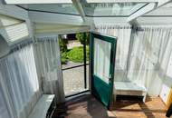 Einfamilienhaus mit Garage &amp; Wintergarten in Ortsrandlage