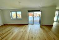 ERSTBEZUG! Geräumige Eigentumswohnung im Obergeschoss mit Balkon und Dachterrasse