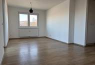 Erdgeschoßwohnung mit eigenem Gartenanteil in zentraler Lage