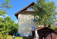 Großzügige Dachwohnung inklusive Eigengarten, Garage und Keller
