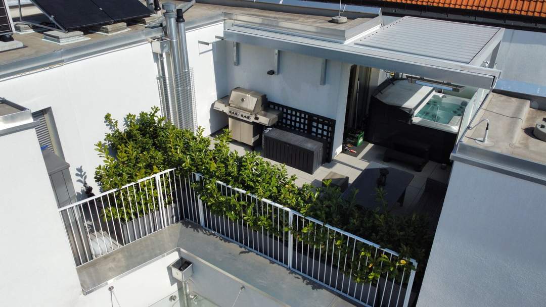 Traumwohnung mit 40 m² Dachterrassen, 2 Garagenplätzen, E-Ladestation und Topausstattung