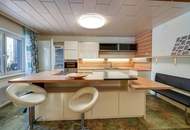 "Ankommen am Promenadenweg: Bungalow im Grünen – nahe Wien mit Potential"