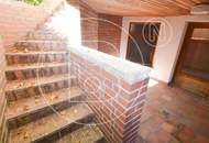 Einfamilienhaus in zentraler Bestlage mit Tennisplatz auf parkähnlichem Grund!