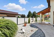 High-end living in a peaceful green location! A feel-good retreat in a class of its own: tradition meets state-of-the-art comfort!