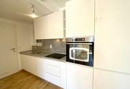 Perfekt geschnittene 2-Zimmer-Wohnung mit Balkon und Gemeinschafts-Dachterrasse