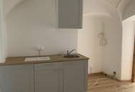 Mehrfamilienhaus mit Geschäftslokal und zwei Wohnungen
