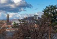 Wohnen über den Dächern von Graz mit Blick auf den Schlossberg: Exklusive Stadtwohnung mit Terrasse