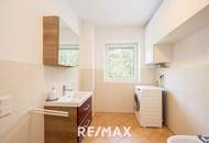 Hochwertige 3-Zimmer-Wohnung mit Tischlerküche, 160 m² Eigengarten, Terrasse und Garage in ruhiger, grüner Lage!