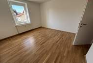 Sonnendurchflutete 2-Zimmer-Wohnung mit herrlichem Grünblick im beliebten Münichholz – liebevoll saniert, mit modernem Wohlfühlbad, praktischen Wohnräumen und perfekter Anbindung für alle, die Ruhe und Stadtnähe zugleich schätzen!