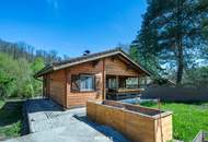 „Wohnen im Einklang mit der Natur – Stilvolles Holzhaus in traumhafter Ruhelage auf unverbaubarem Grundstück“