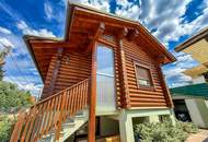 Chalet-Feeling mitten in Donaufeld - Naturstamm-Blockhaus mit Sauna, Kamin und Garten