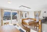 Etabliertes Ferienhaus-Ensemble am Millstätter See. Zwei moderne Häuser mit bestehender Vermietung. Investment.