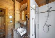 „Wohnen im Einklang mit der Natur – Stilvolles Holzhaus in traumhafter Ruhelage auf unverbaubarem Grundstück“