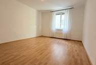 Karmeliterplatz-Charme trifft modernen Komfort – 2-Zimmer-Neubauwohnung mit Stellplatz im Innenhof.