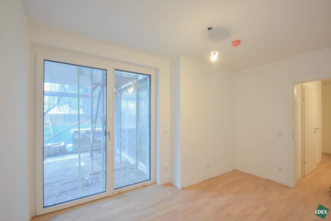 Erstbezug: Schöner 3-Zimmer-Neubau mit Terrasse und Garten