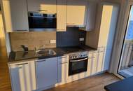 Exklusiver Neubau im 10. Stock mit Seeblick, Kochinsel & großzügigem Balkon – moderne 3-Zimmer-Wohnung