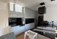 Moderne & zentrale 2-Zimmer-Eigentumswohnung mit Garten und Tiefgaragenplatz