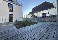 Erstbezug: 3 Zimmer-Mietwohnung mit sonnigen Terrassenflächen und Garten