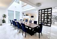 Zeitlose Architektur trifft Großzügigkeit - Designvilla mit Indoor-Pool und Einliegeroption