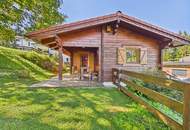 Sonnberg - Ruheoase mit Mittagskogelblick: Blockhaus auf 660m² Bauland in Finkenstein am Faaker See