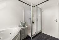 Wohnen über den Dächern von Graz mit Blick auf den Schlossberg: Exklusive Stadtwohnung mit Terrasse