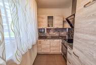 Sofort beziehbar! Neubauwohnung mit neuer Küche, 10m2 Balkon, Parkplatz und Grünblick - Fernwärme