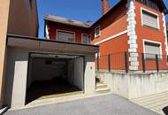Stadthaus mit Geschäftsräumen, Wohneinheit, Garage und Stellplätzen – für Eigennutzer und Anleger
