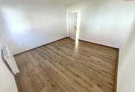 Herrlich sanierte Erdgeschosswohnung mit moderner Wohnküche, stilvollem Badezimmer und Grünblick - in ruhiger Siedlungslage mit ausgezeichneter Infrastruktur, ideal für kleine Familien!