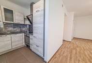 Sofort beziehbar! Neubauwohnung mit neuer Küche, 10m2 Balkon, Parkplatz und Grünblick - Fernwärme