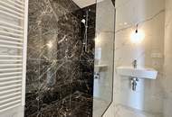 STUDIO-WOHNUNG mit Balkon! I Stellplatz in hauseigener Tiefgarage I hochwertige Einbauküche I Fußbodenheizung I bodenebenerdige Dusche I U1 ca. 13 min. mit Öffis