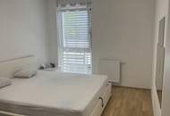 Moderne und helle 2-Zi-Wohnung mit Balkon & Tiefgarage an der Grenze zu Wien
