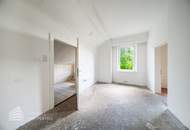 Sanierungsbedürftiges Wohnhaus mit 24 Wohneinheiten in Hanglage