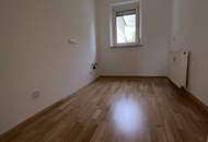 Gemütliche 3- Zimmer Wohnung im Erdgeschoss bietet ein ideales Zuhause für kleine Familien oder Paare - inmitten einer grünen Umgebung ohne auf beste Infrastruktur verzichten zu müssen! Erstbezug nach Sanierung!