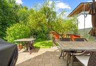 Zuhause im Grünen – Lichtdurchflutete Maisonette mit Gartenoase und Wasserblick