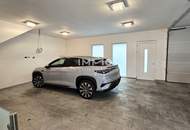 Zeitlose Architektur trifft Großzügigkeit - Designvilla mit Indoor-Pool und Einliegeroption