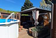 GANZJÄHRIG BEWOHNBAR!!!Pflegeleichter Garten mit Pool, Vollholzhaus Lärche wird verkauft!
