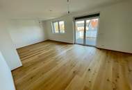 ERSTBEZUG! Geräumige Eigentumswohnung im Obergeschoss mit Balkon und Dachterrasse