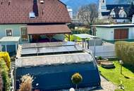 Charmante Dachgeschosswohnung mit Eigengarten & Doppelcarport
