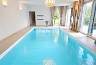Zeitlose Architektur trifft Großzügigkeit - Designvilla mit Indoor-Pool und Einliegeroption