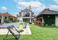 Modernes Mehrfamilienhaus mit Terrassen, Garage, Pool, Outdoorküche, Spielplatz uvm.